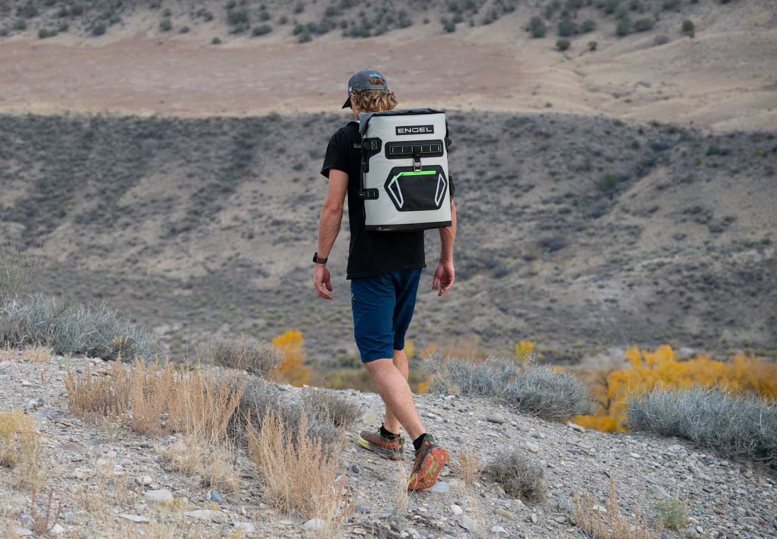 man wearing Engel Roll Top High Performance Backpack Cooler