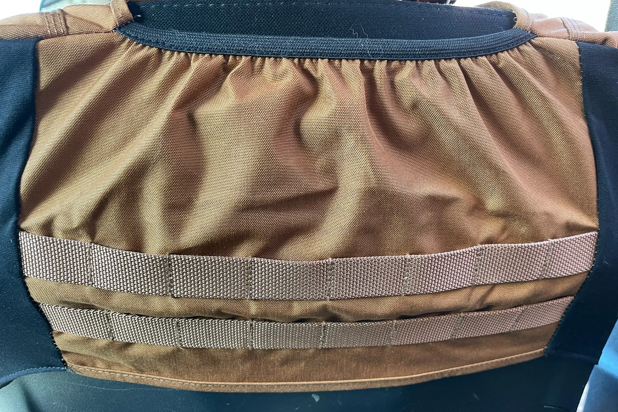 Seat back with gear loops for added organization