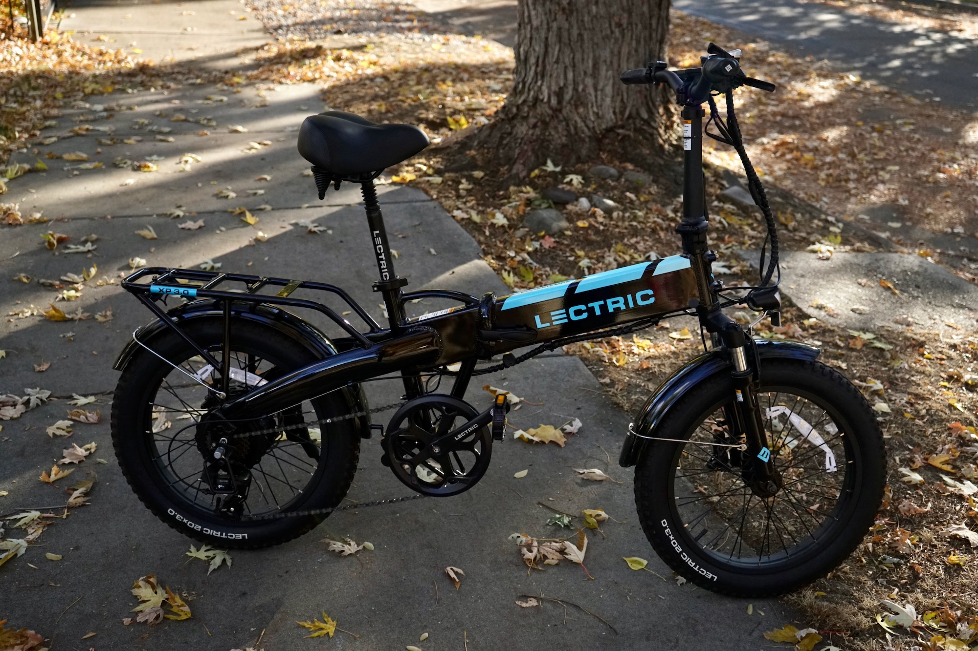 The Lectric XP 3.0 folding electric bike parked on a sidewalk