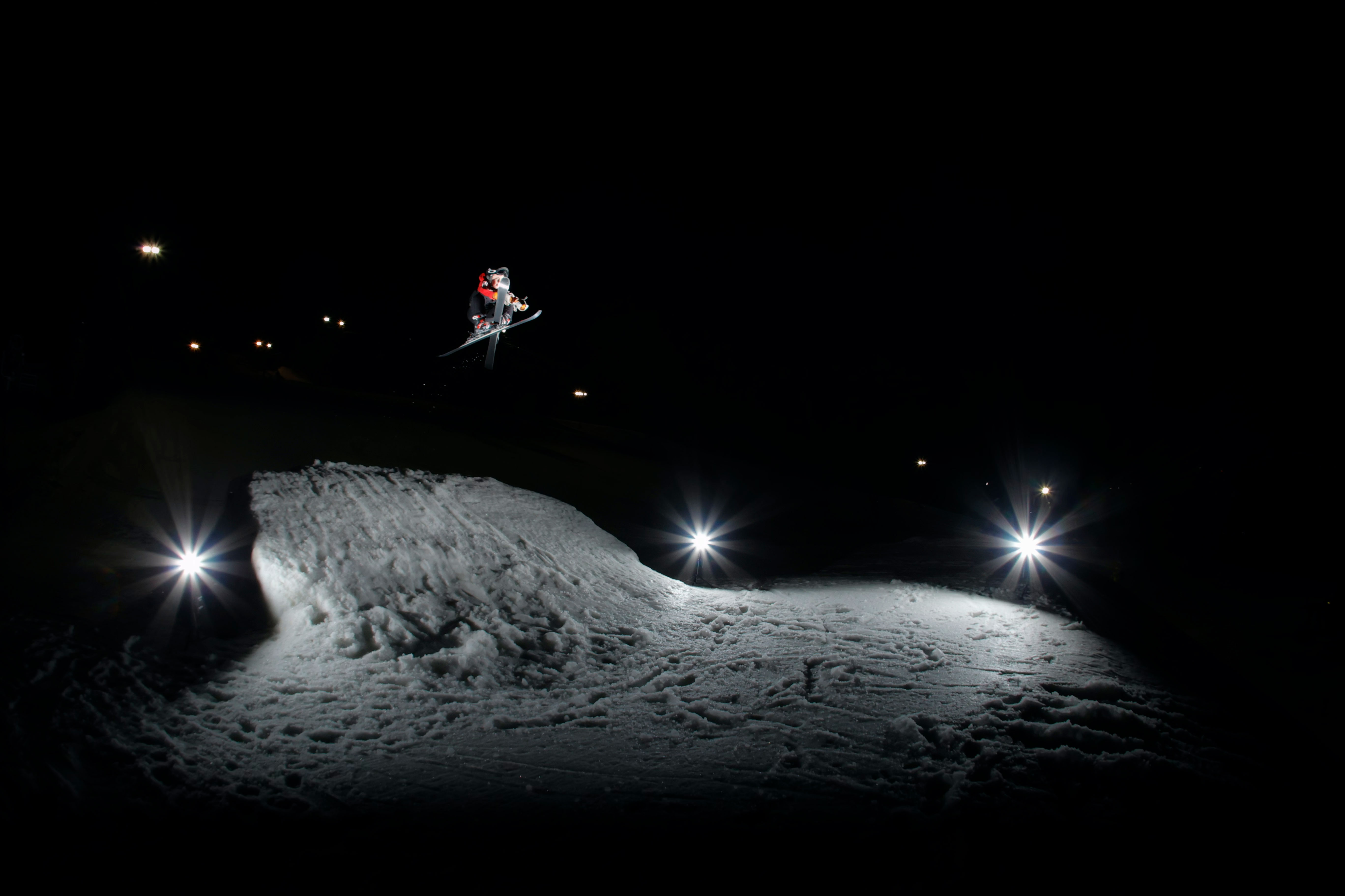 Skier in air at night