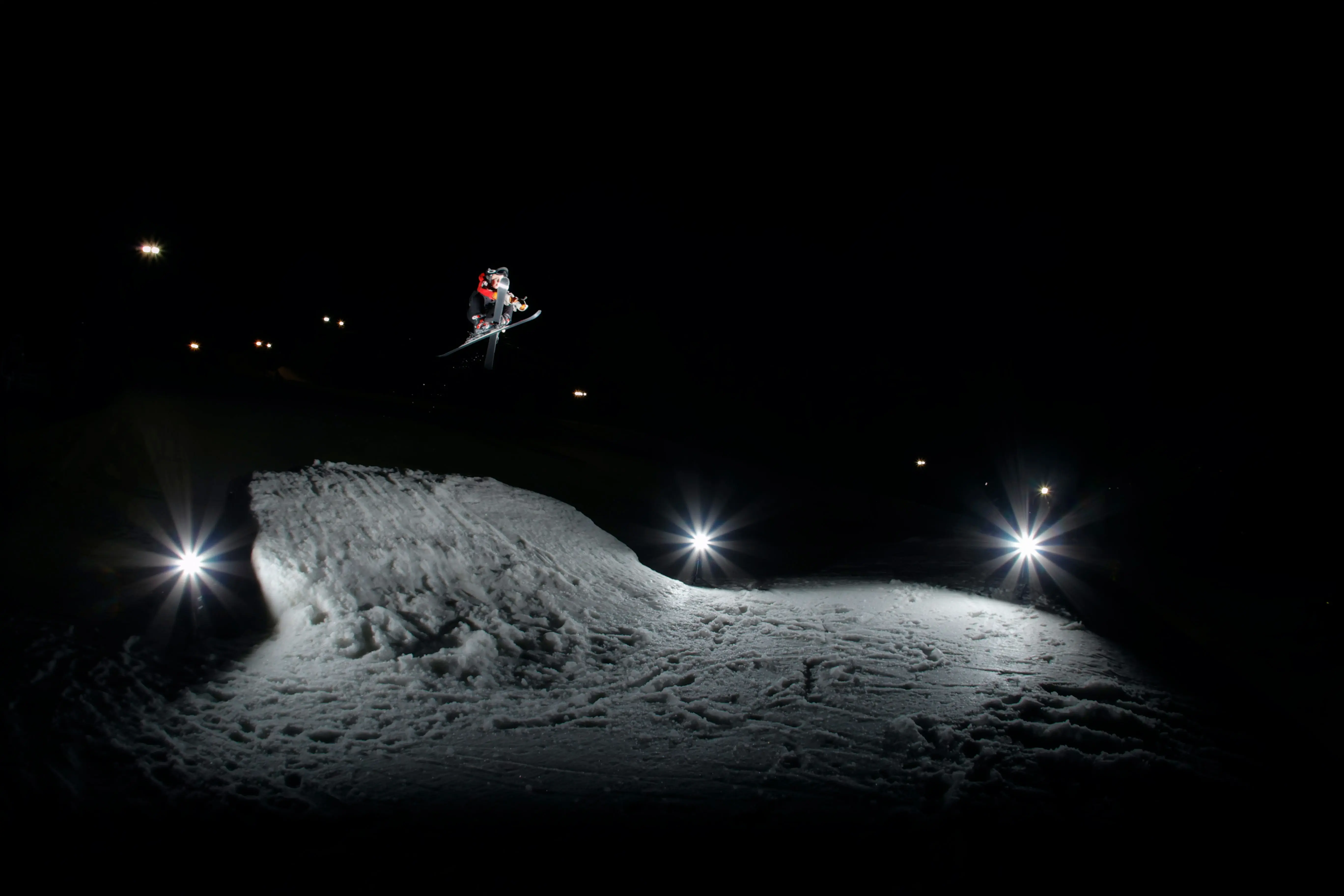 Skier in air at night