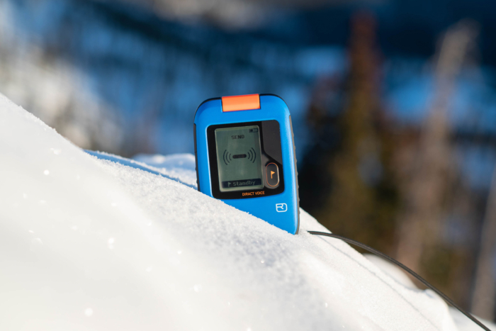 Ortovox Diract Voice beacon placed upright in fresh snow