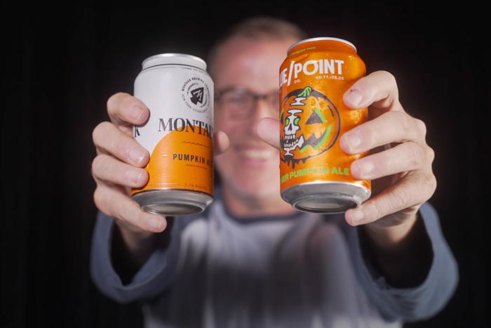 paul pabst beerjunkie holds up two pumpkin beers