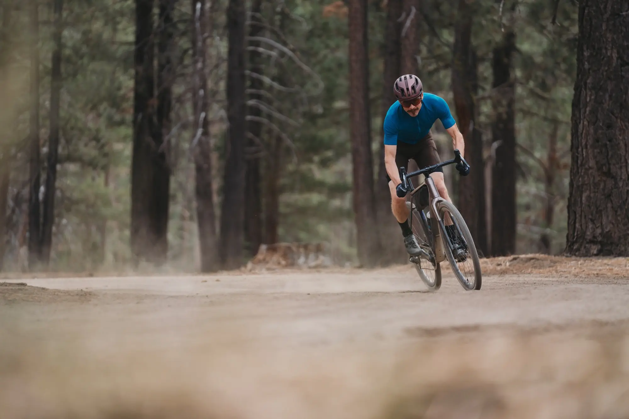 Leaning the Trek Checkpoint SL Gen 3 over slightly while turning on a gravel road 