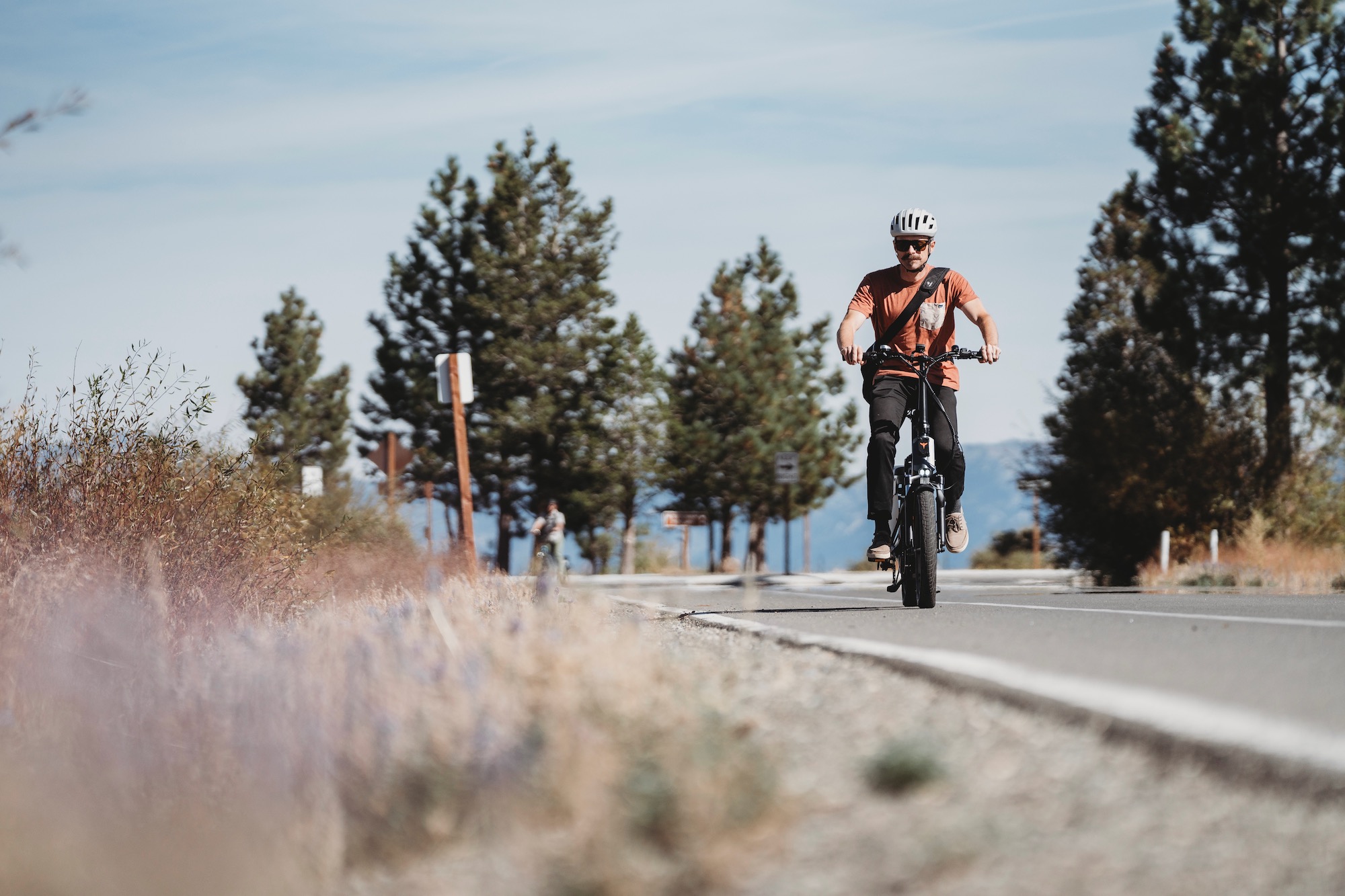 Riding the ENGWE LE20 on a paved bike path during testing
