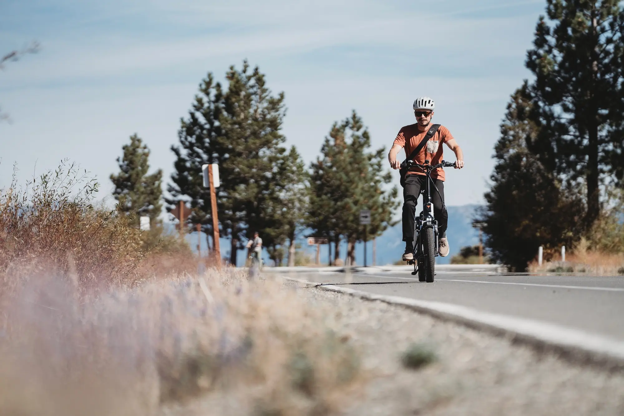 Riding the ENGWE LE20 on a paved bike path during testing