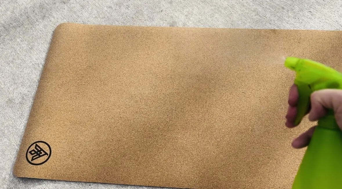spray bottle with cleaning liquid in it, asivana flux cork yoga mat in the background