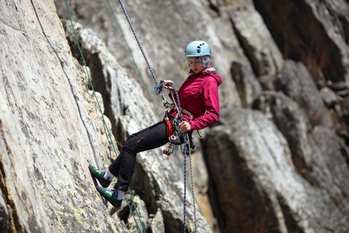 young woman climber rappel