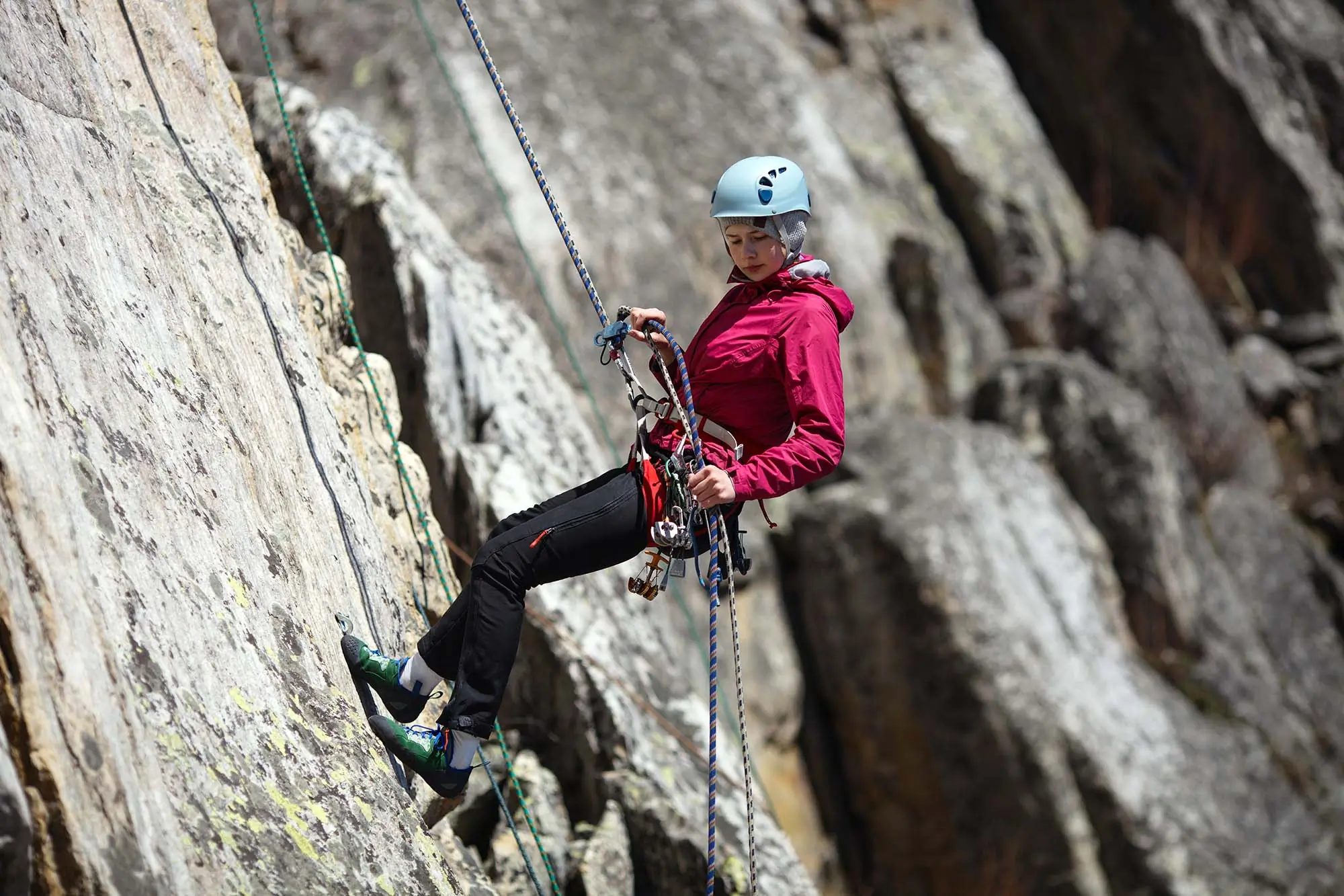 young woman climber rappel