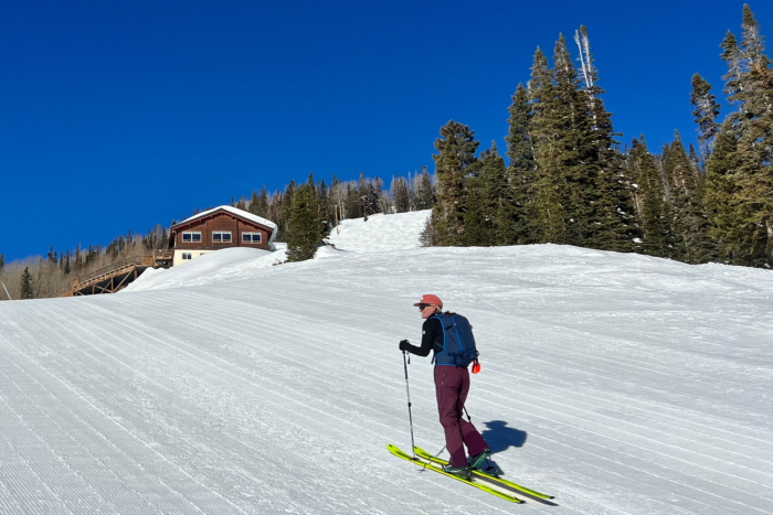woman skiing in black diamond recon lt pants