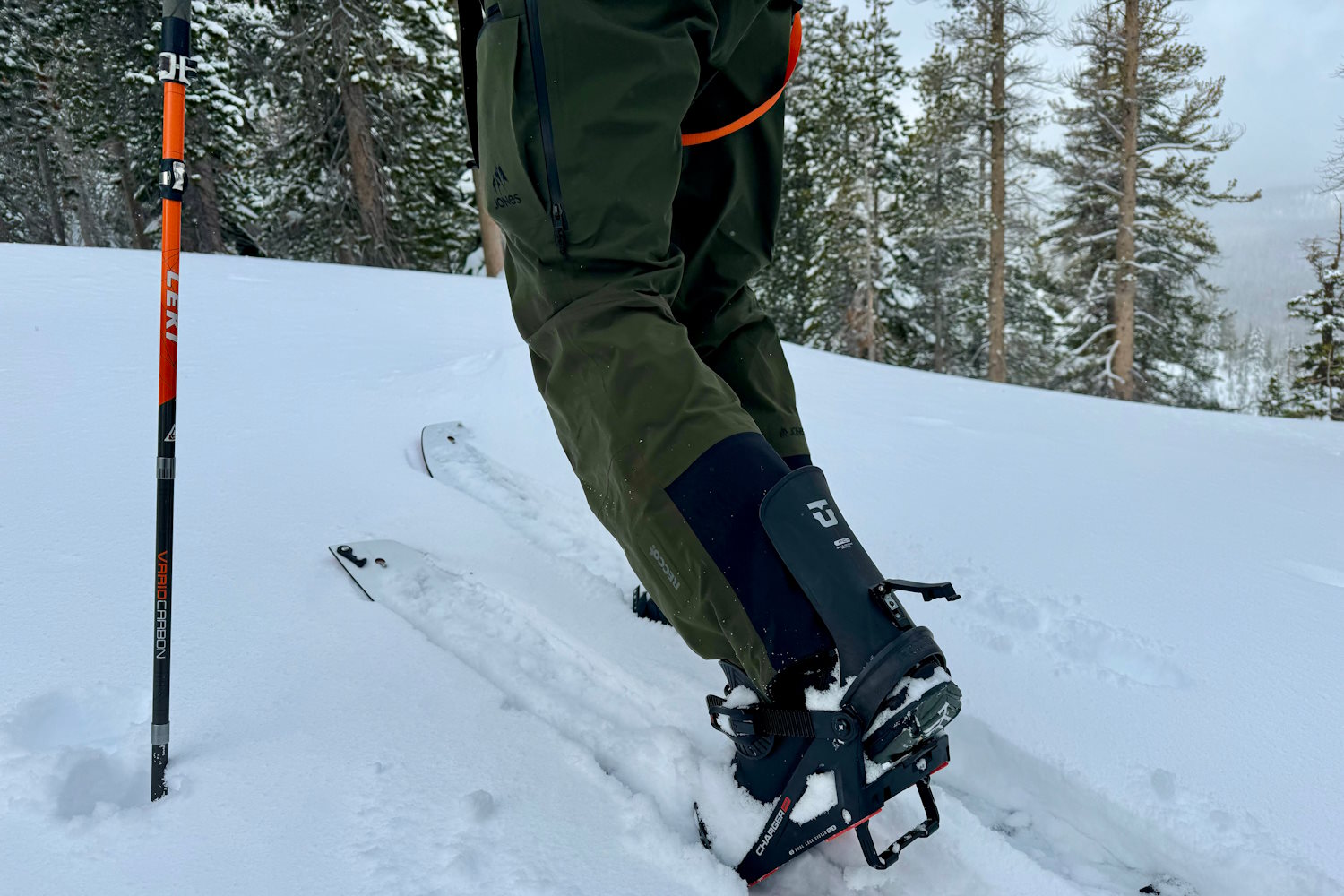 Splitboarder climbing uphill with boots