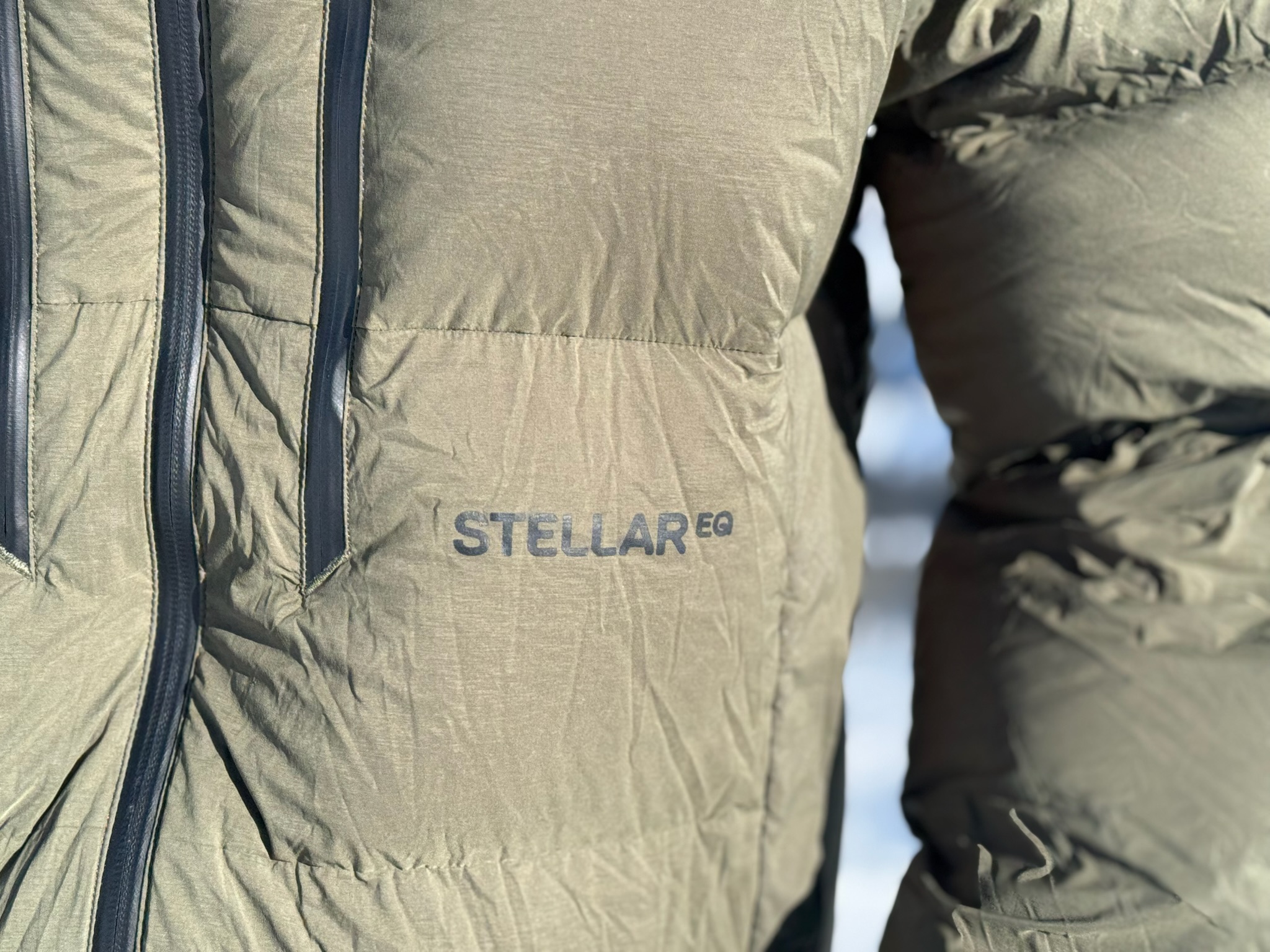 Close-up of the Stellar EQ logo on the Stellar Free Down Parka