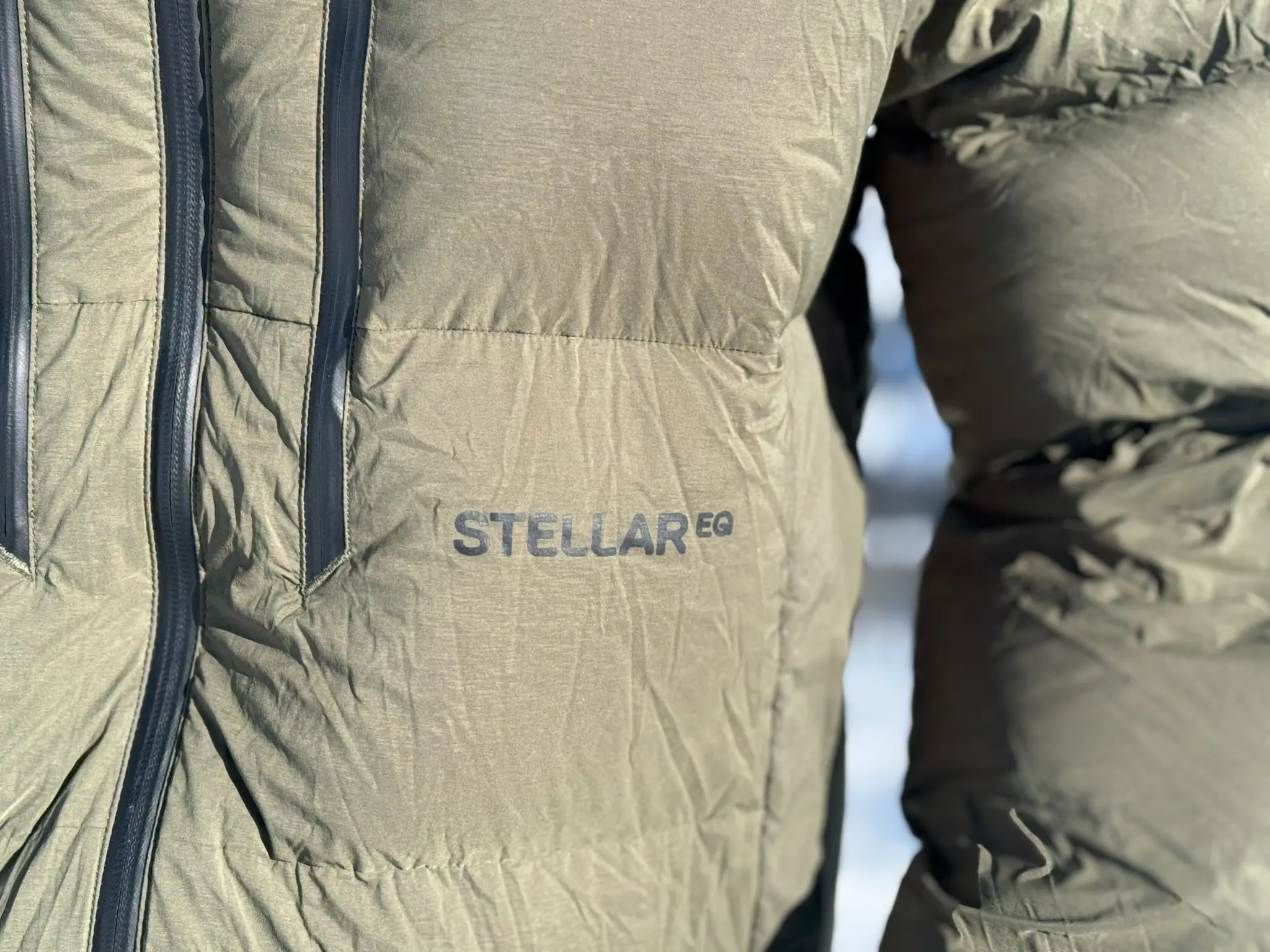 Close-up of the Stellar EQ logo on the Stellar Free Down Parka