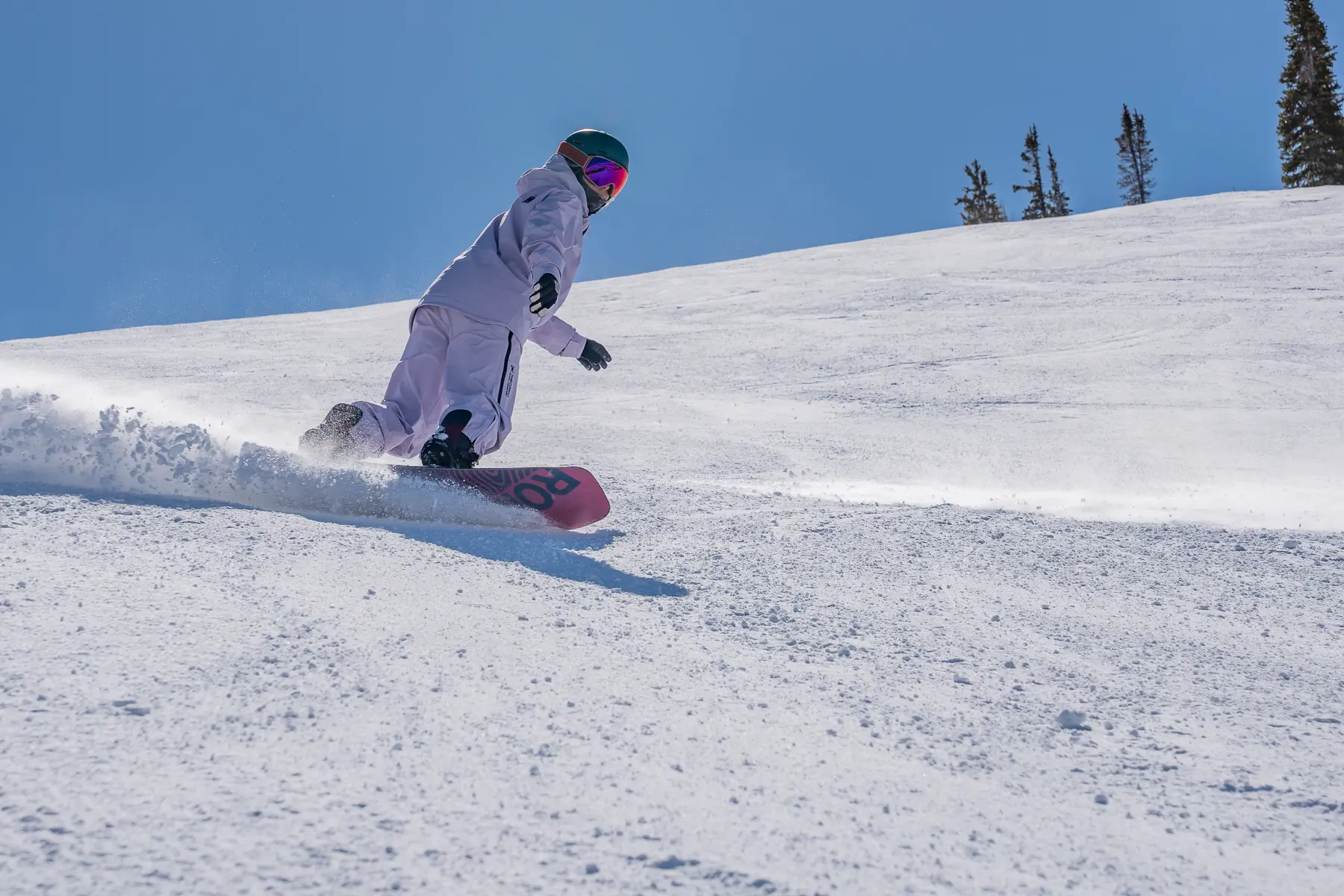 Snowboarder riding the Rome Ravine