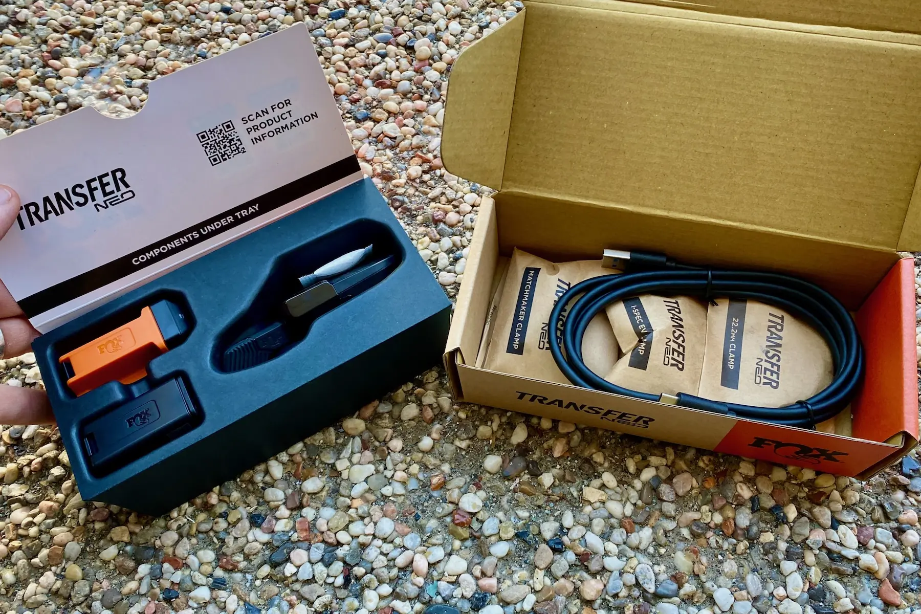 The remote, battery, charger, charging cord, and mounting option included with the Transfer Neo dropper post