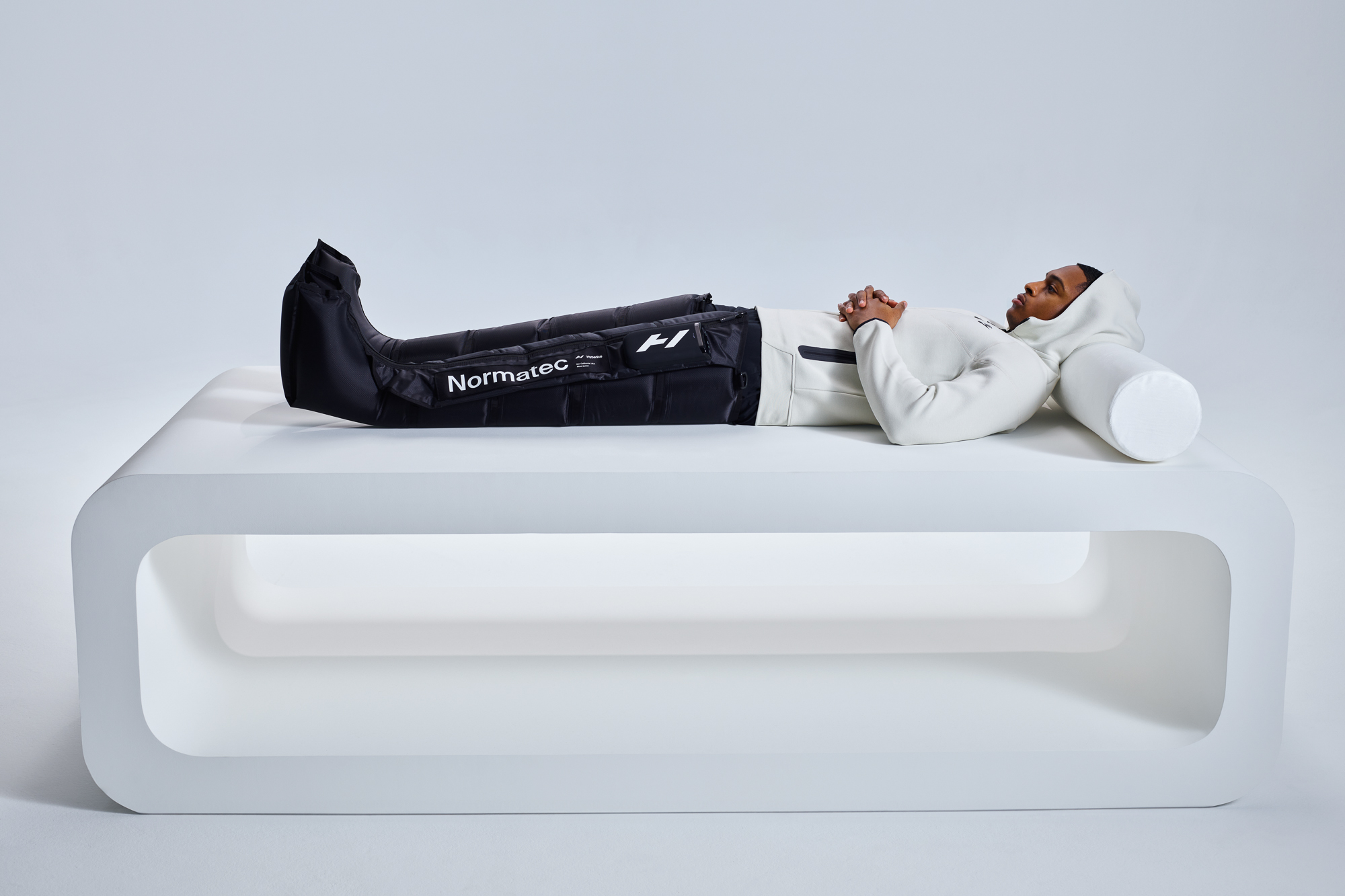 Hyperice Normatec Elite compression boots on man