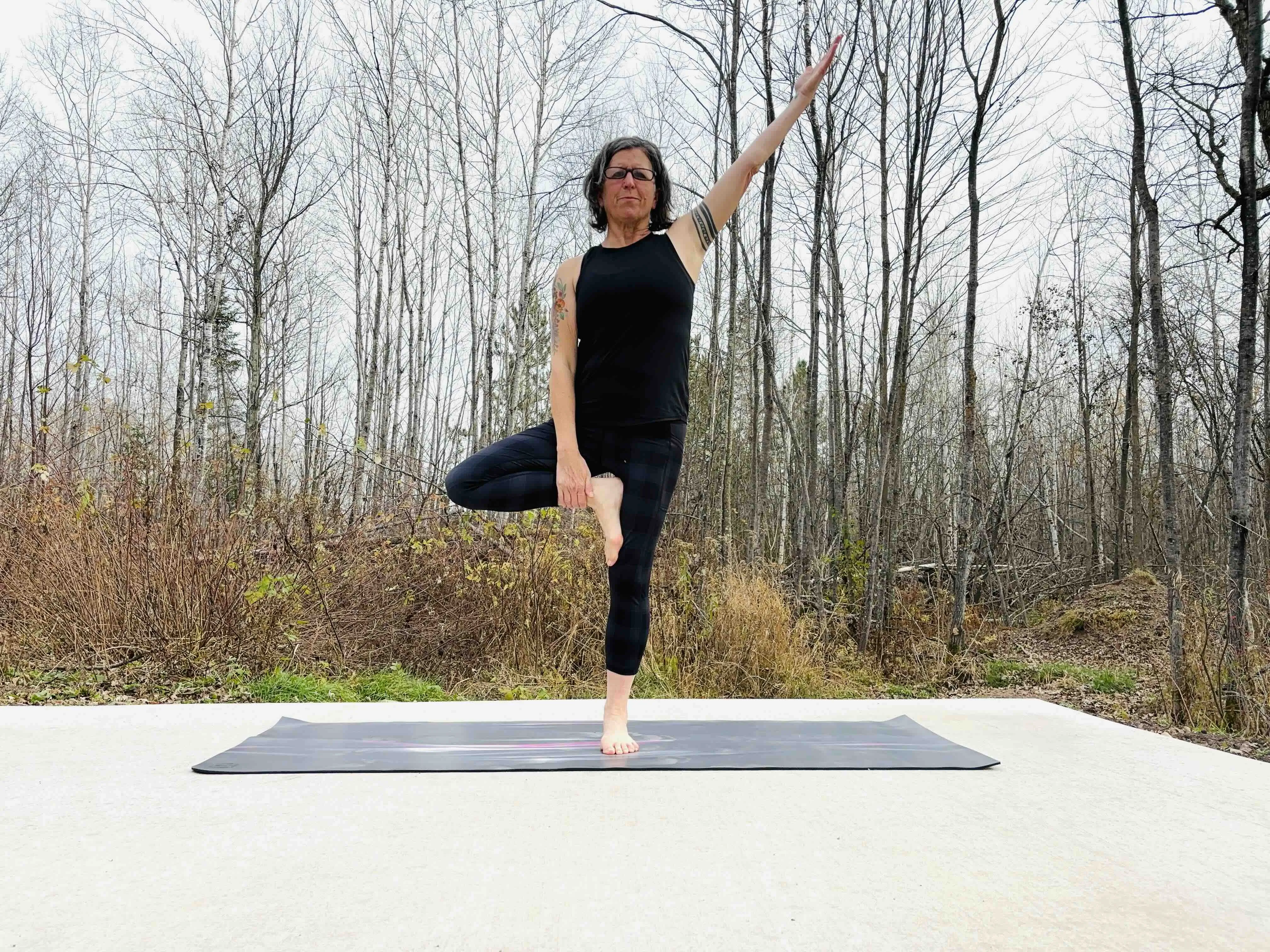 The author testing Lululemon's The Mat yoga mat