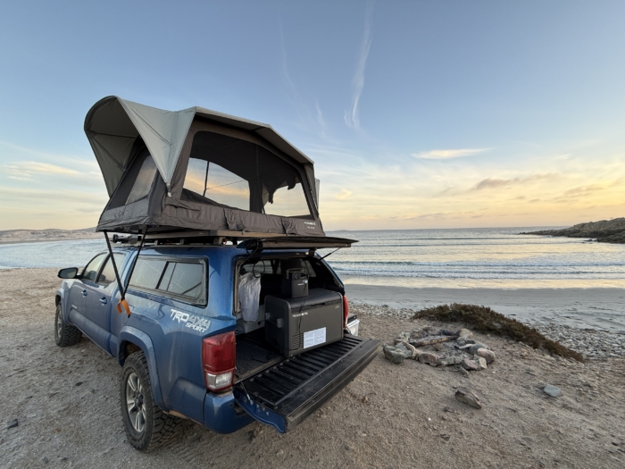Dometic CFX 55IM Electric Cooler in truck bed on beach 