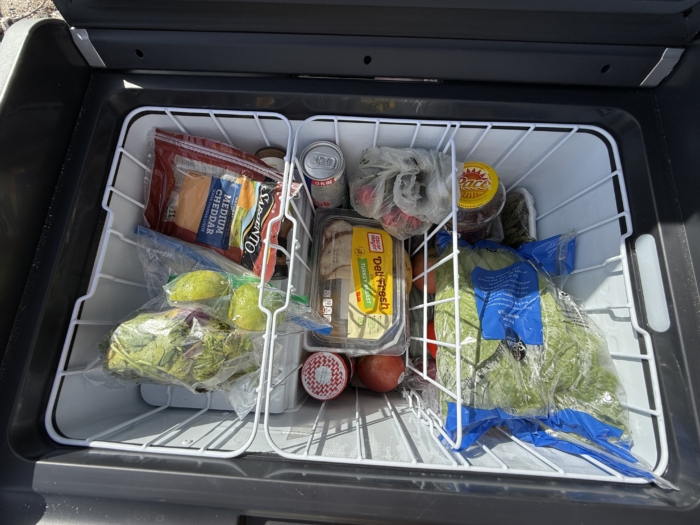 The wire baskets filled with food in the Dometic CFX 55IM Electric Cooler 