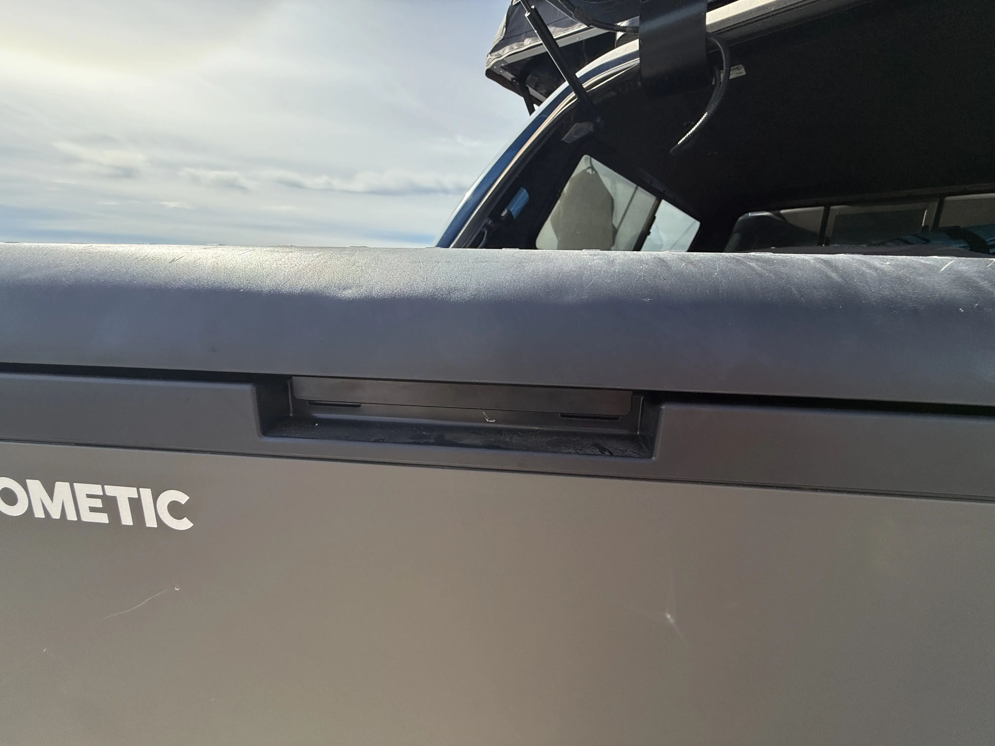 open/close latch on the CFX 55IM Electric Cooler 