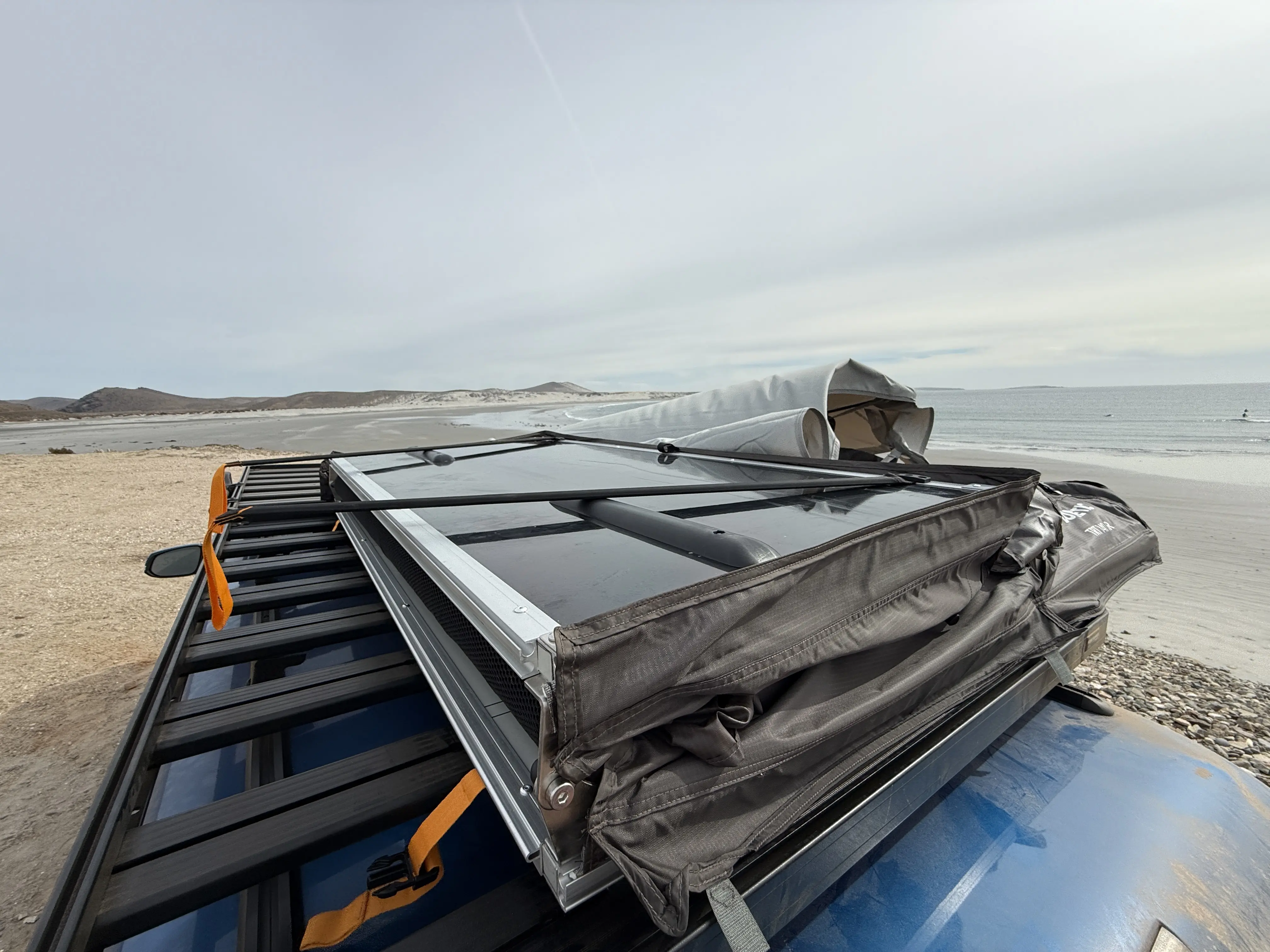 Folding up the Dometic TRT 140 Air Inflatable Rooftop Tent