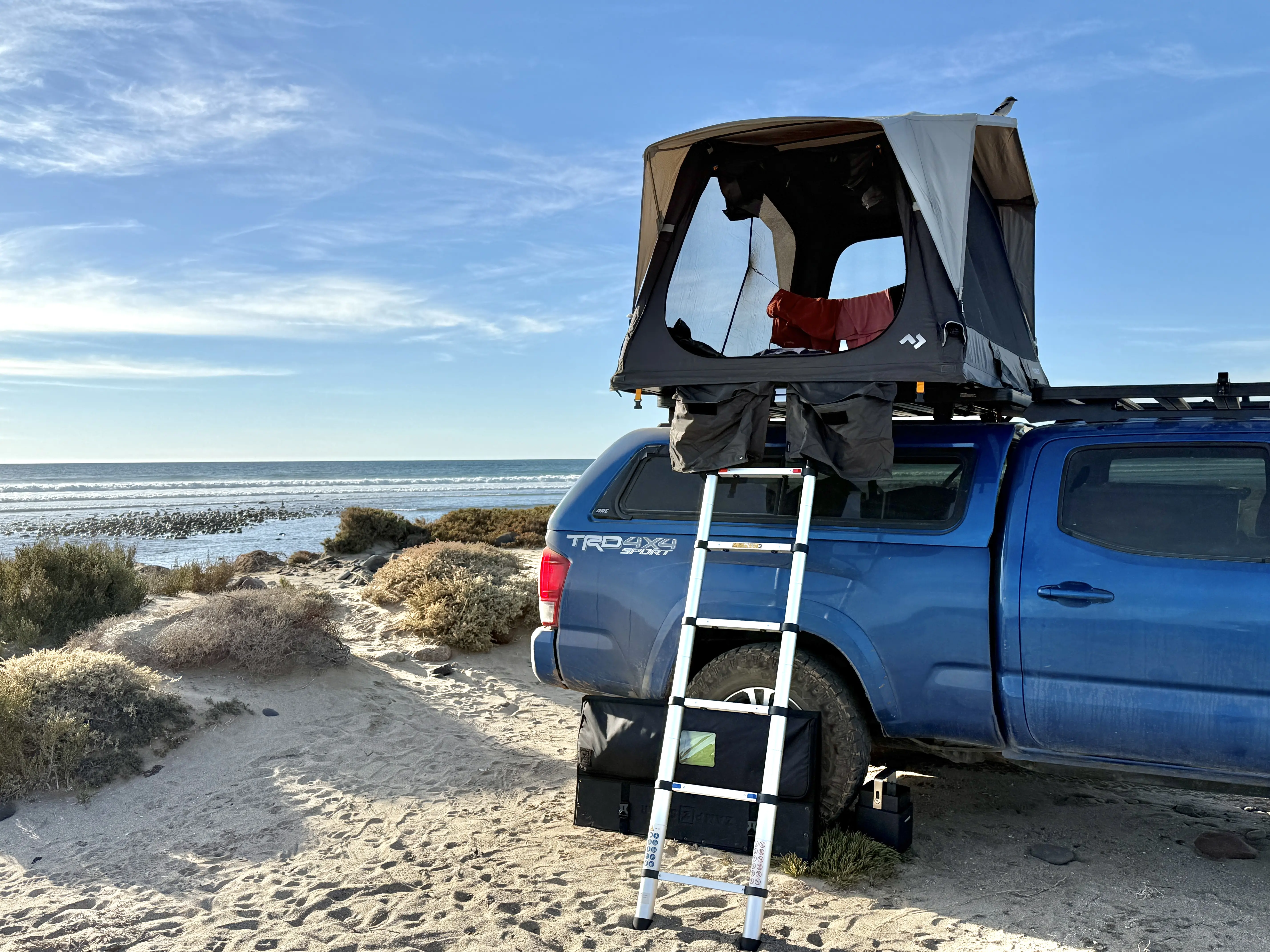 The Dometic TRT 140 Air Inflatable Rooftop Tent has 360-degree views through mesh walls with optional solid walls