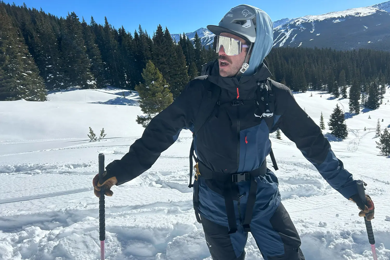 Skier wearing the Salewa Sella Free 3L Powertex jacket and pants in snowy terrain