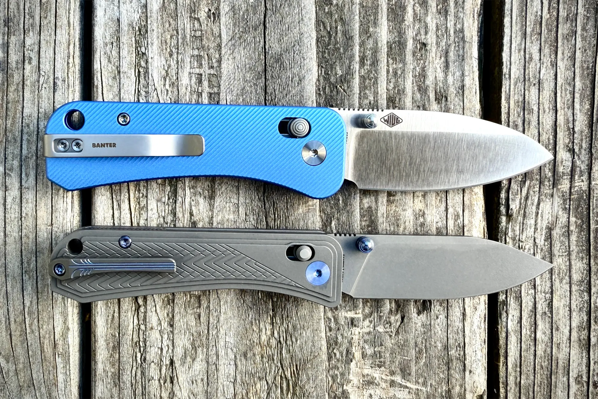 Side-by-side comparison of the WE Knife Bougie (bottom) and the Banter (top), showcasing their distinct handle designs and blade styles on a wooden surface