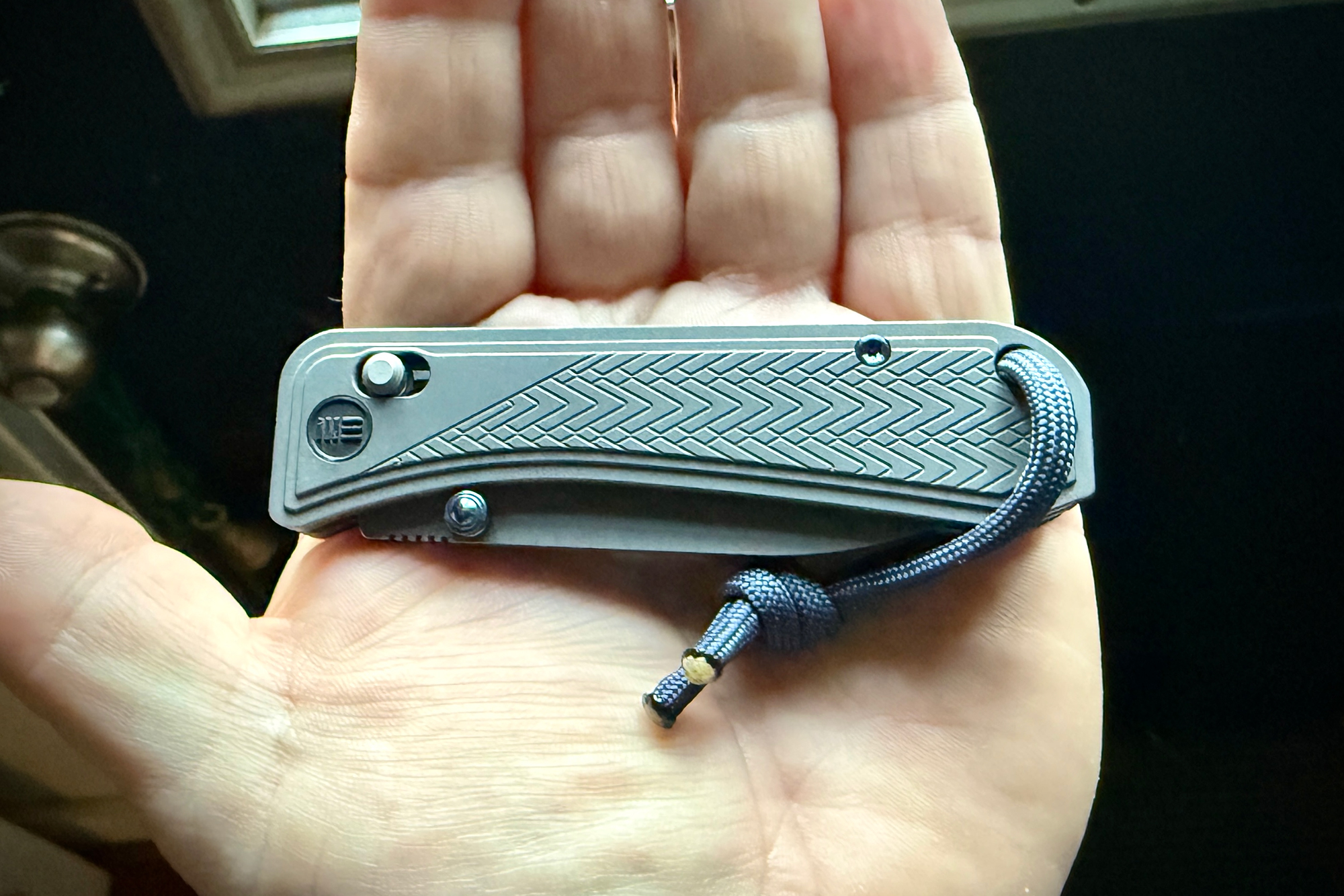 The WE Knife Bougie, compactly folded, fitting perfectly in the palm for everyday carry convenience