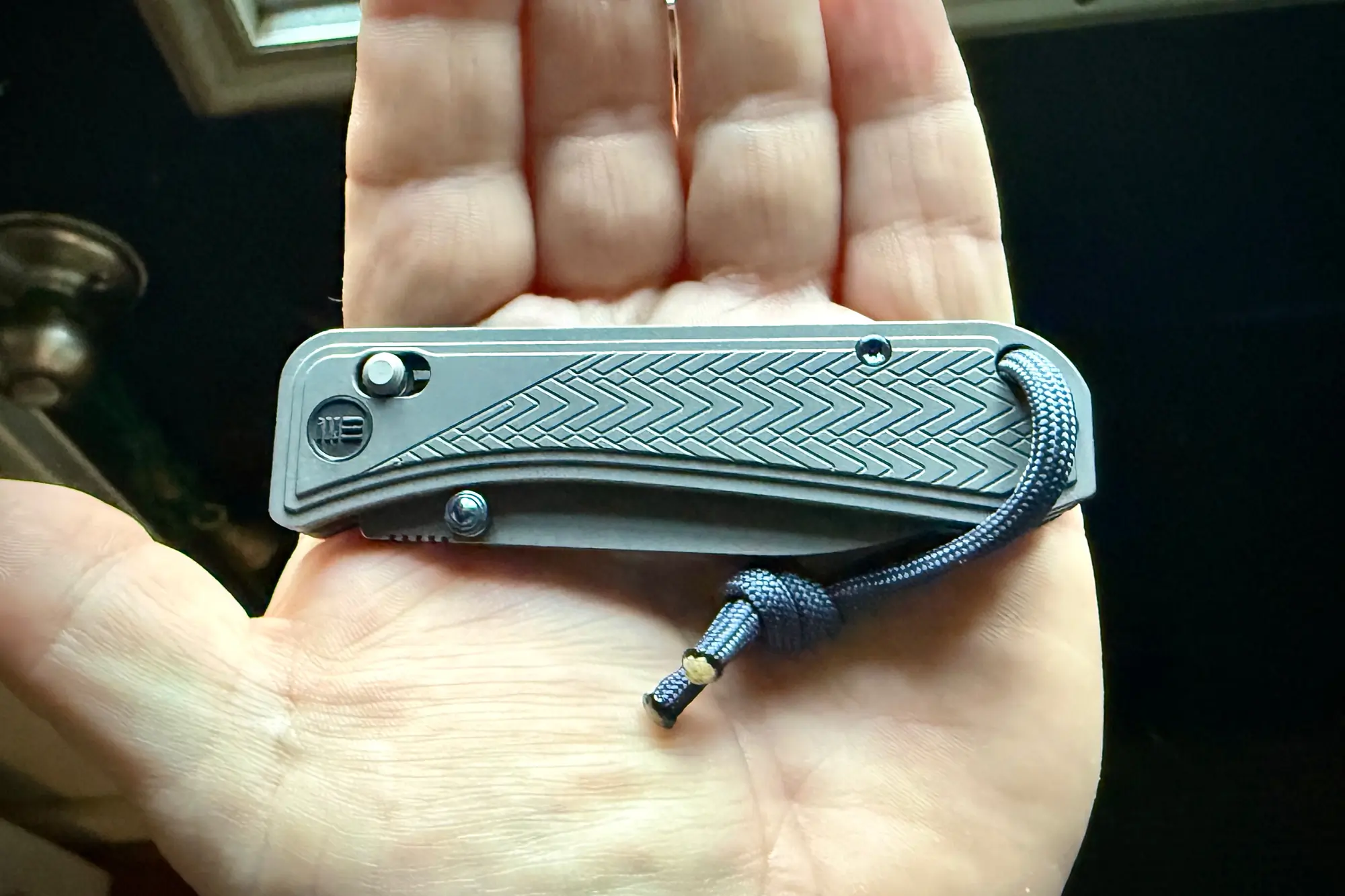 The WE Knife Bougie, compactly folded, fitting perfectly in the palm for everyday carry convenience