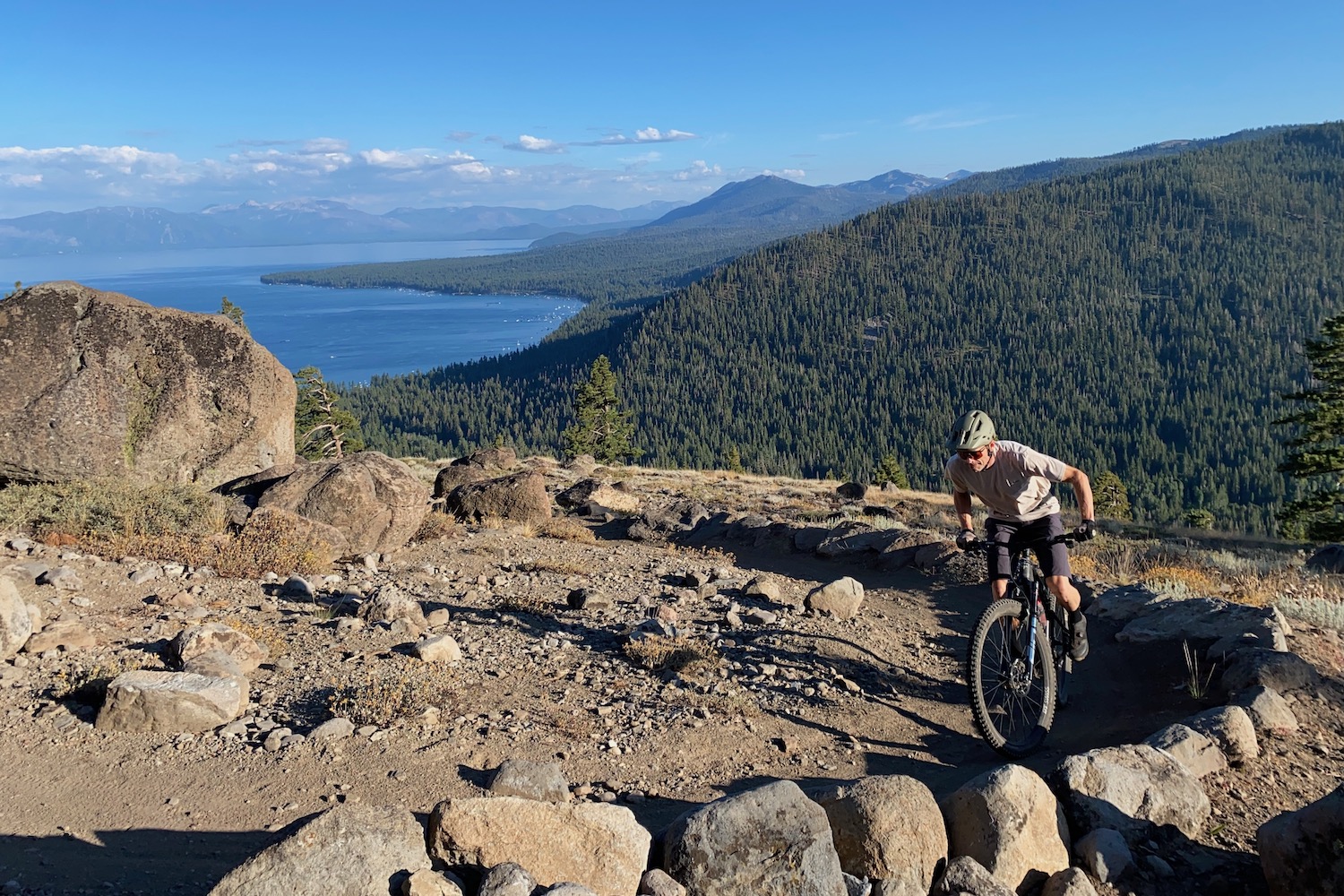 Climbing up a mountain bike trail on the Yeti ASR with Lake Tahoe in the background.