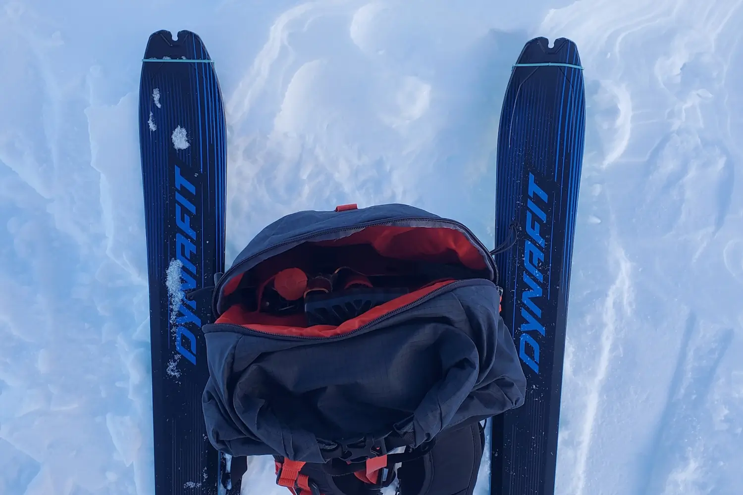 Zippered pocket with items inside pack