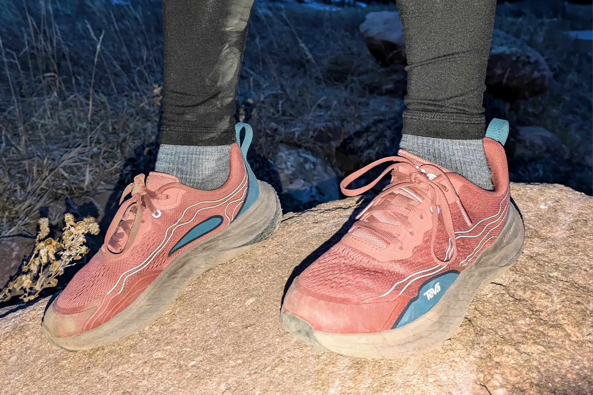 Teva Trailwinder Low Hiking Shoes on a rocky trail at dusk