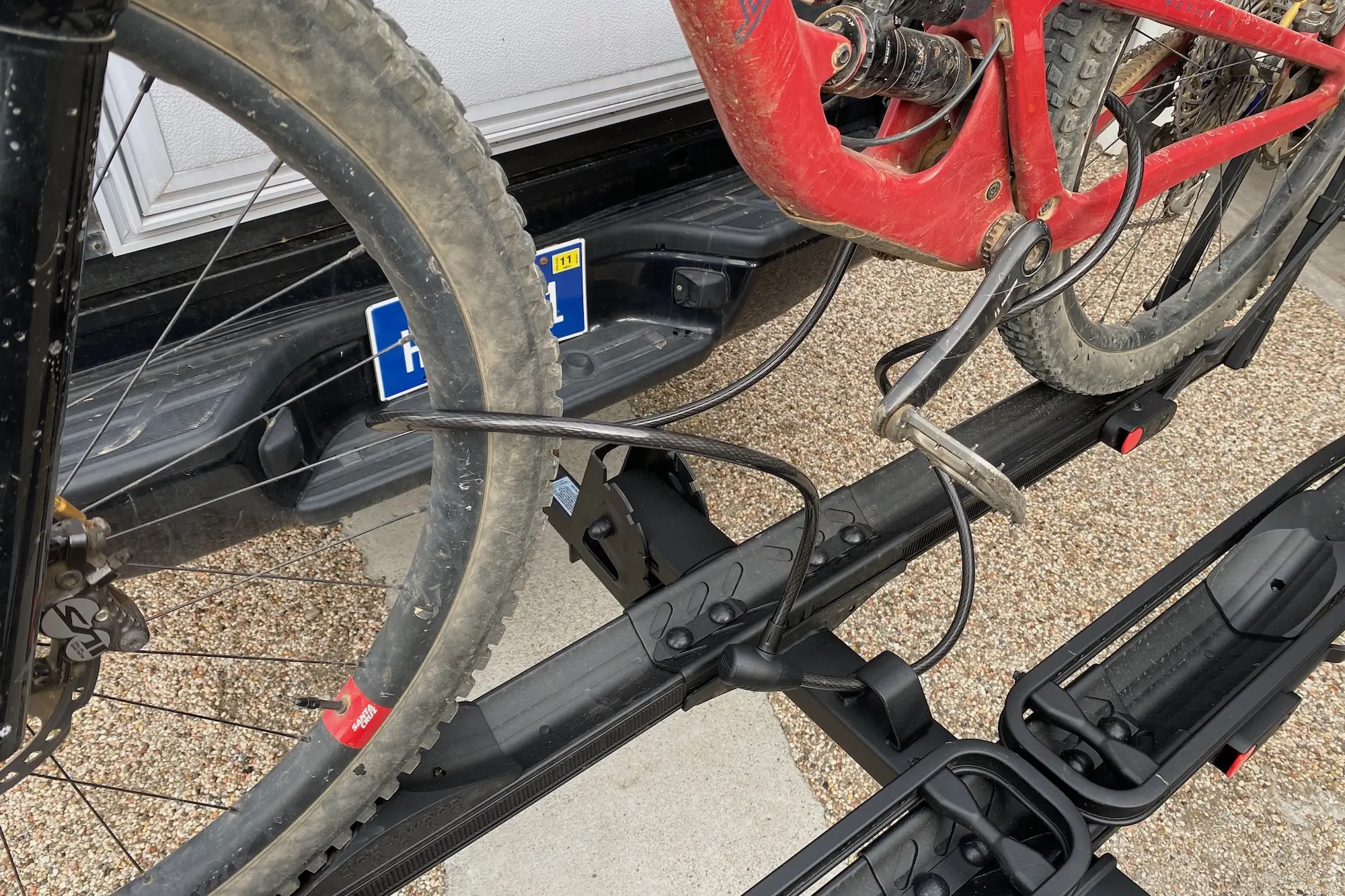 The included cable lock and welded lock loop being used to lock a bike on the Hollywood Racks CrossTrack bike rack