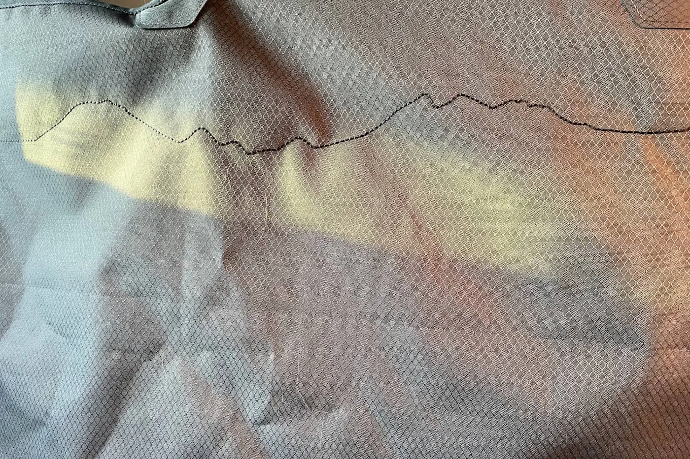 Close-up of the Ruffwear Dirtbag seat cover showing the embroidered embellishment detail