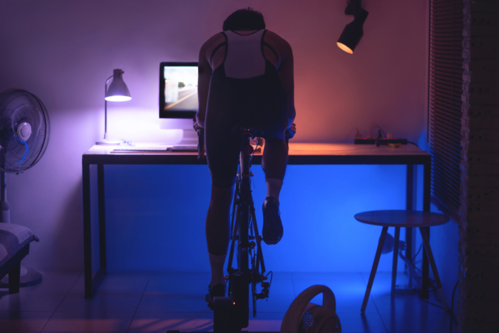 man cycling indoors