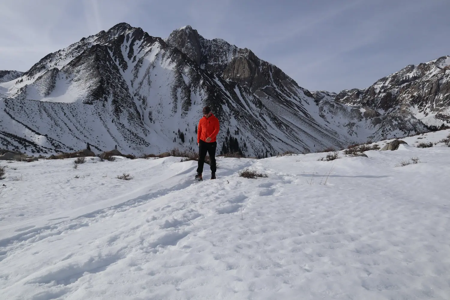 A person winter hiking with the St. Elias in Mammoth Lakes