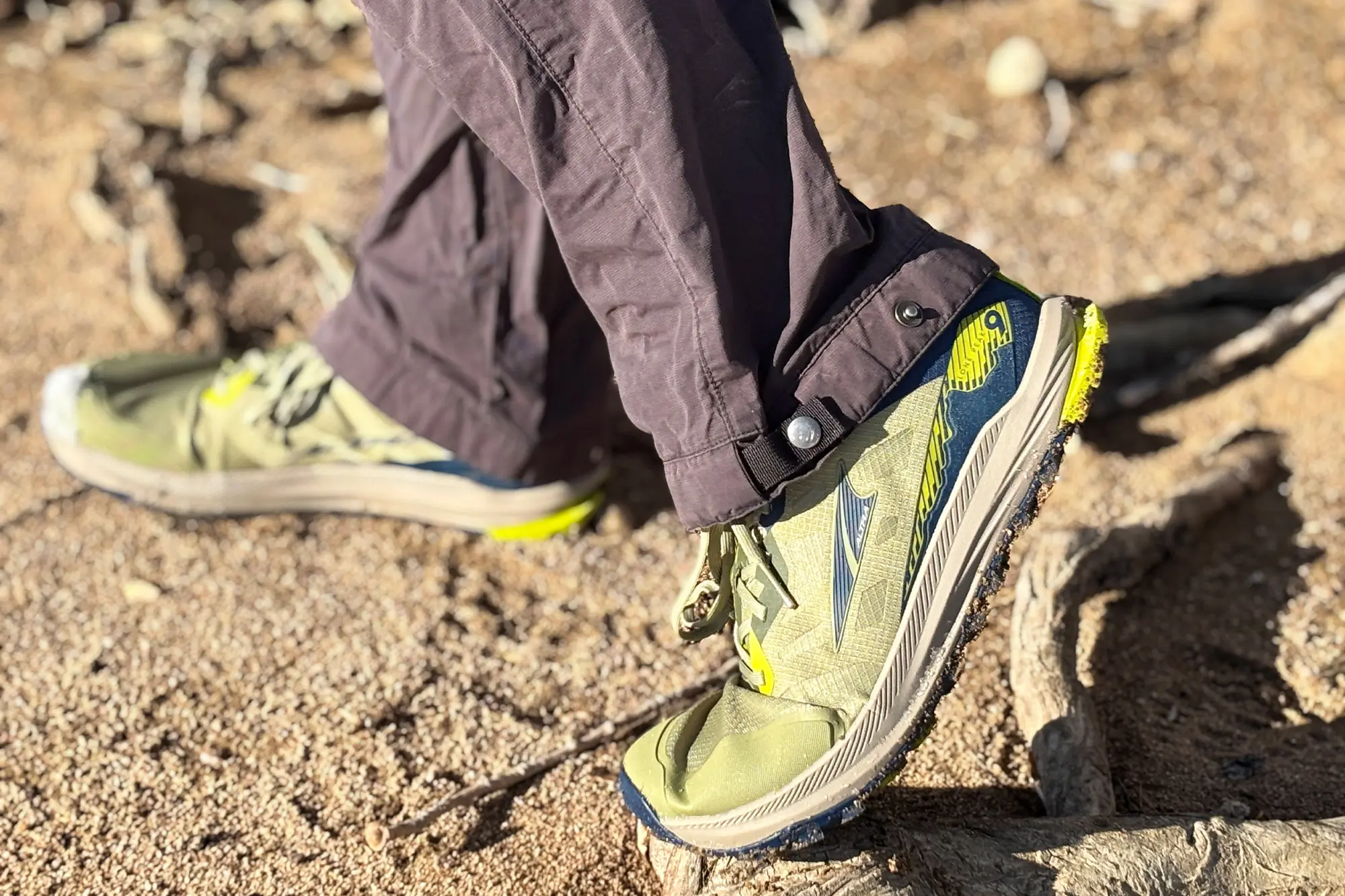 Altra Lone Peak 9 on a rugged desert trail, highlighting its breathable upper and secure fit