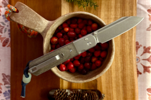 Artisan Cutlery Holm resting on a bowl of cranberries