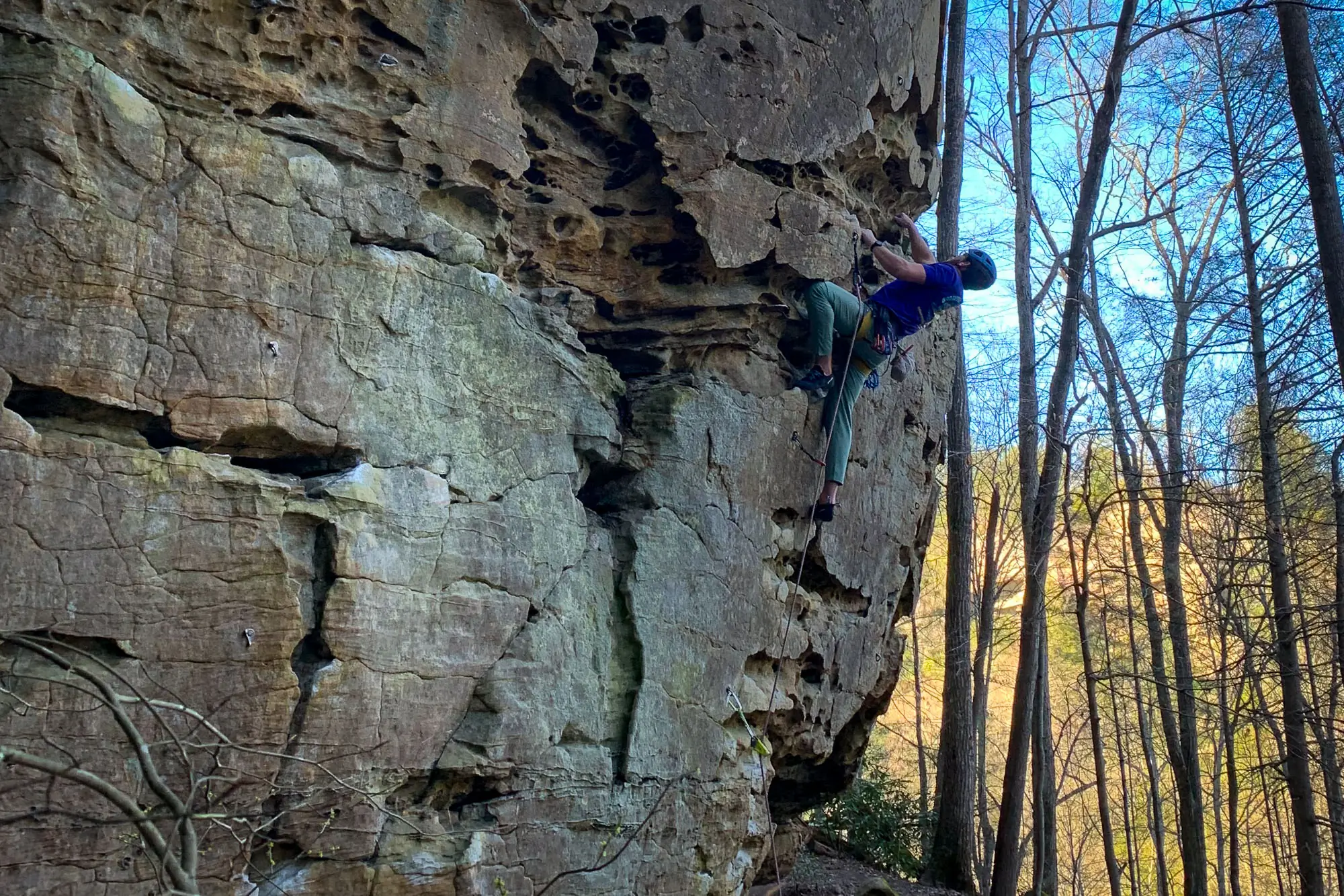 Rock climber leading at the Red River Gorge