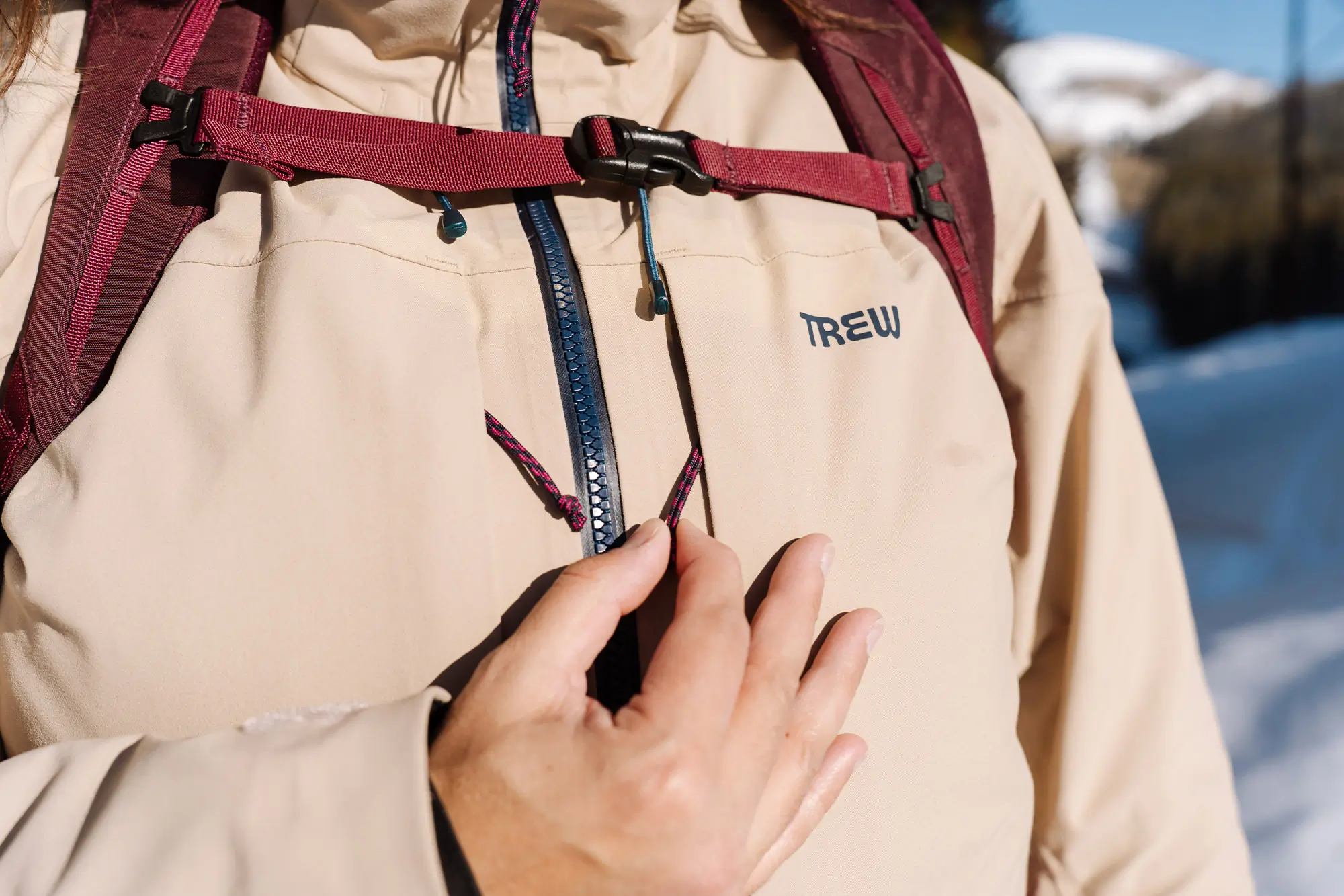 Close-up of the Trew Gear Women’s Stella Jacket PRIMO-Plus chest pocket being unzipped