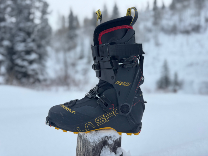 Side view of the La Sportiva Kilo ski boot standing on a wooden post