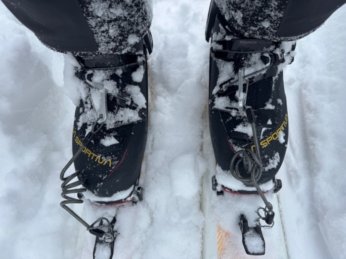 La Sportiva Kilo ski boots clipped into bindings, covered in fresh snow