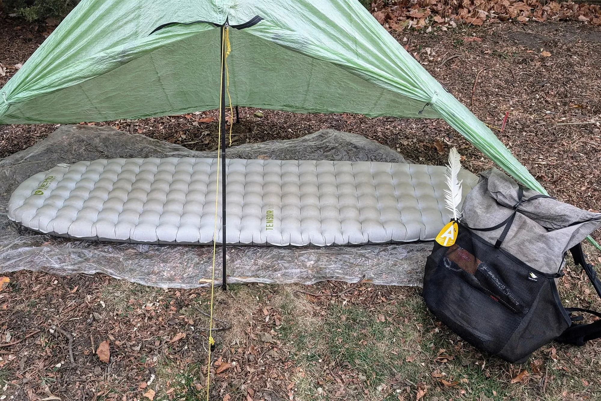 NEMO Tensor Elite Sleeping Pad set up under a tarp shelter