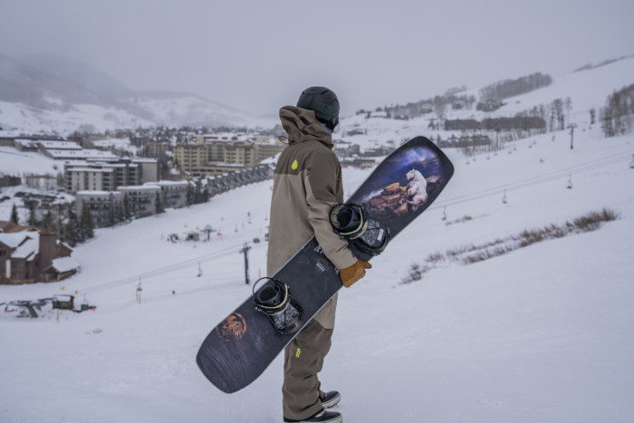 Rider Holding the Never Summer Nohku Board on the Slope