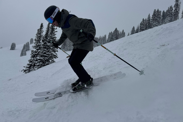 A skier putting the Scott SEA 108 to work on a snowy descent