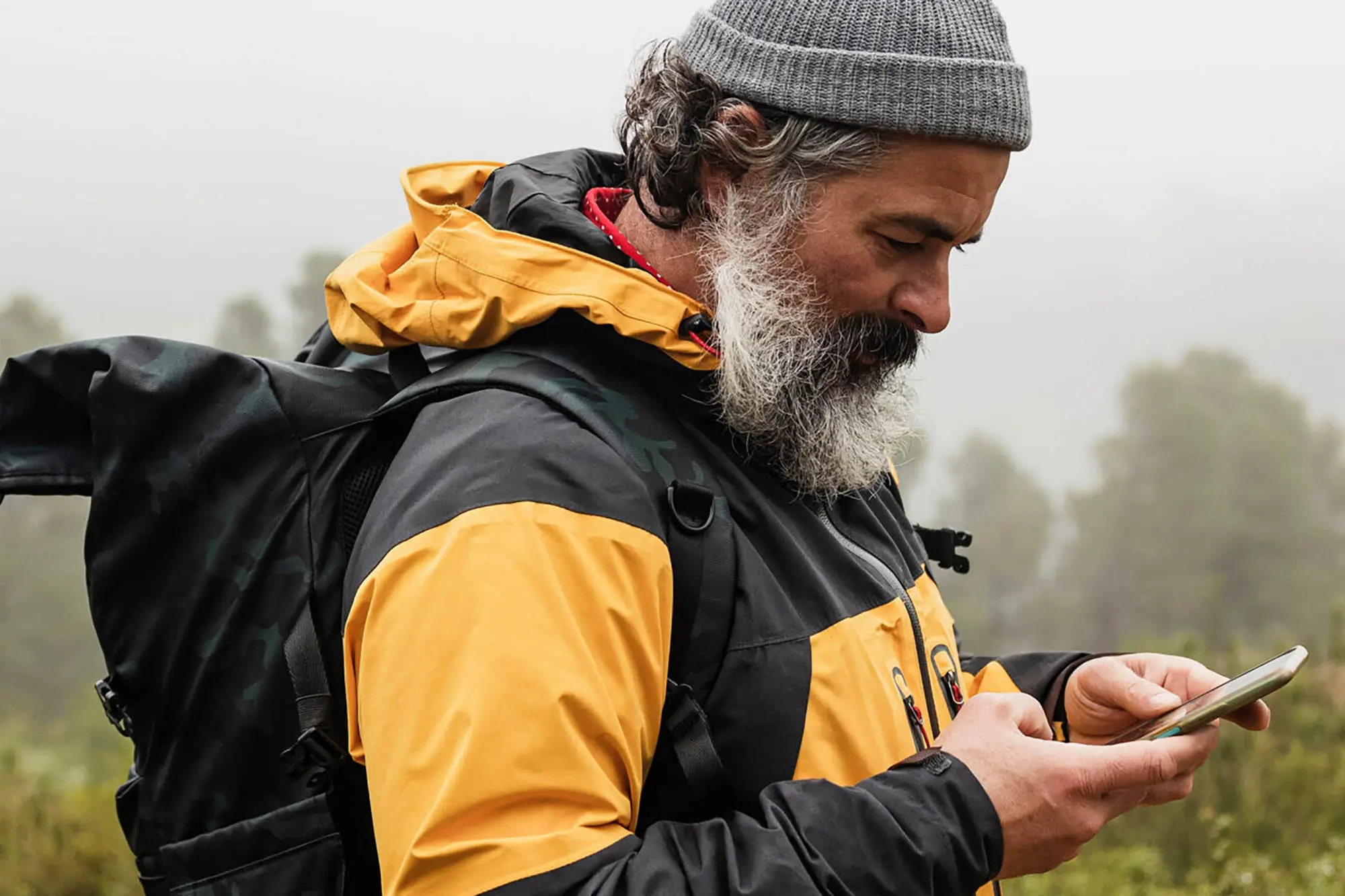 hiker checking phone