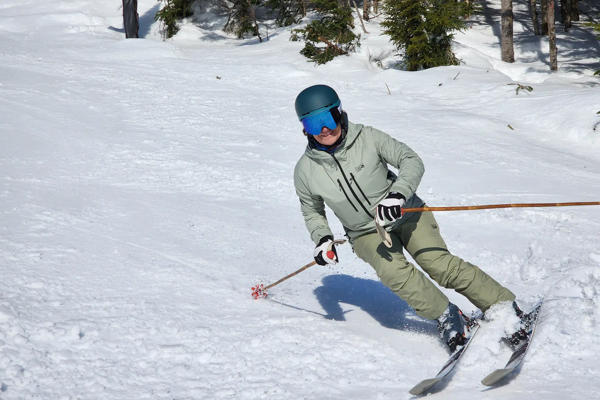 Atomic Maven 103 CTI skiing on powdery snow with trees in the background