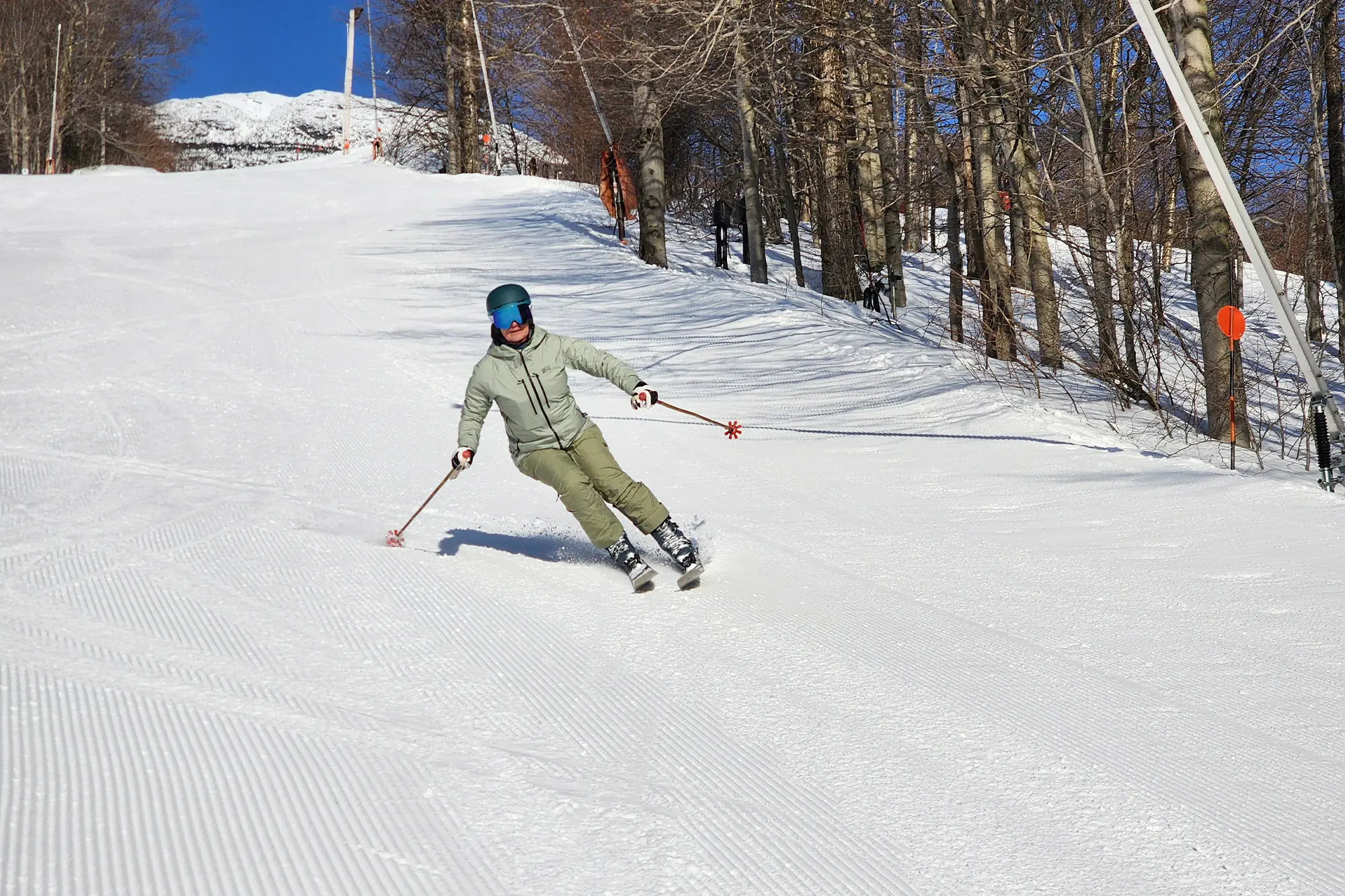 Atomic Maven 103 CTI turning on groomed slopes with clear skies
