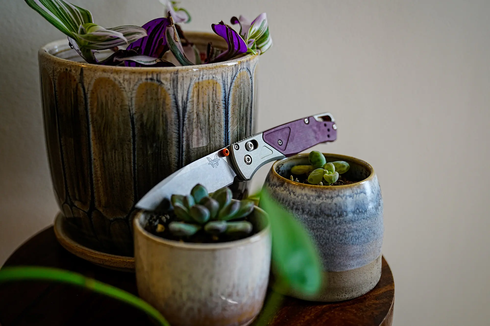 The Benchmade Bugout 535-09 is placed between two potted plants